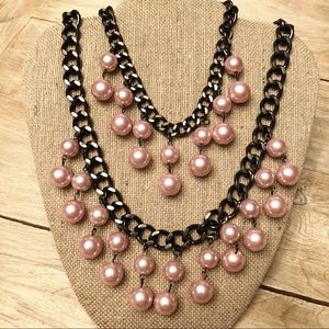 Double strand double “pearl” drop necklace.